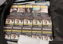 Police say that a total of 255 packets of cigarettes and 62 pouches of tobacco were seized, along with his car