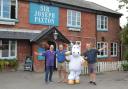 Dave Roseby, Gary Parker and Dave Fawcett with the mascot from Abby's Heroes