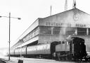 : One of the engines shunts three carriages alongside the port of Southampton’sformer great building the Ocean Terminal in 1962.
