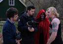 Callum Brown (centre) with cast and crew working on The Red Veil