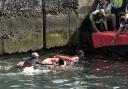 Survivors of a capsized boat are rescued in the port of El Hierro (Europa Press via AP)