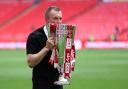 Charlton Athletic manager Nathan Jones with the League One play-off trophy after winning at Wembley