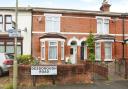 Terraced property with gated front garden and an allocated off-street parking space