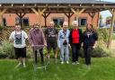 Scouts and residents plant flowers and friendships in garden revamp