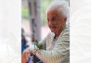 A resident gets hands-on with an exotic insect during a surprise visit