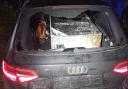 Officers from Hampshire, Dorset and Wiltshire police forces had to team up to arrest the driver of a stolen Audi, which had a stolen ATM in the back.