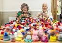 Woodpeckers residents Dawn Pearson and Phyllis Farmer with hats knitted at the Colten Care home in aid of the Big Knit