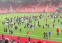A pitch invasion at St Mary's Stadium following a charity match on Saturday, June 7