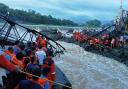 Rescuers work at the site of a bridge collapse near Pune, India (AP Photo)