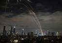 The Israeli Iron Dome air defence system fires to intercept missiles during an Iranian attack over Tel Aviv (Leo Correa/AP)
