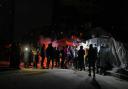 Palestinians line up to buy dinner at a food stand near the beachfront in Gaza City (AP Photo/Jehad Alshrafi/AP)
