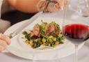 Roast rump of lamb with a glass of red wine