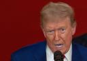 President Donald Trump speaks from the East Room of the White House (Carlos Barria/Pool/AP)