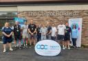 Staff at Itchen College, alongside Joe Colmer, and Lucy Callingham from AOC Sport gather outside The Colmer Building as Glenn Colmer is posthumously inducted into the AOC Sport Hall of Fame