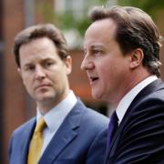 Archive photo of former Prime Minister David Cameron, right, and his then deputy Nick Clegg holding their first joint press conference in 2010. PA