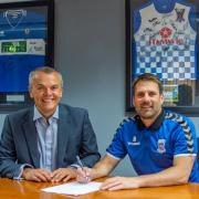 AFC Totton Chairman Stephen Snow (left) pictured alongside First Team Manger Jimmy Ball (right) after the latter signed a five-year deal (Pic: Craig Hobbs Photography)