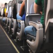 The man was sat on an economy flight when the passenger in front attempted to recline her seat