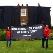 Greenpeace activists blanketed the home in black fabric in protest over Rishi Sunak’s North Sea oil announcement earlier this week