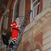 Father Christmas being rescued from the Town Hall 2013, photo: Charles Burnett, Romsey Local