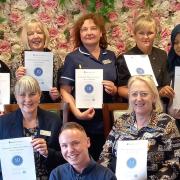 Southampton Manor Care Home staff are all smiles with their certificates from Carehome.co.uk