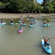 Volunteers on paddle boards helped clean-up Bartley Water at Eling Tide Mill as part of a Paddle UK campaign