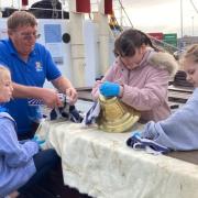 The girls chipped in with volunteer crew members to get the steamship ready for its weekend sail