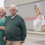 Left to right: Anne and Graham Hunter at the mural of their daughter Claire