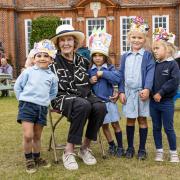 Ex-royal milliner Louisa McIntyre with pupils at Walhampton School where she judged a hat competition