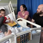 Reece Wilton with his parents, Eliabeth and Ashley