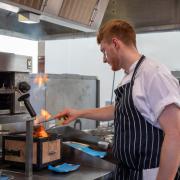 Lewis Huggins at work in the kitchen