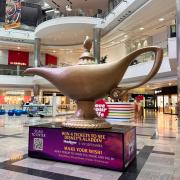 The sizable golden lamp will inhabit Level 2 at the shopping hub until August 18