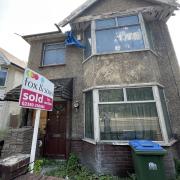 The partially destroyed home has been sold at auction