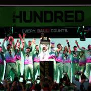 Oval Invincibles' Sam Billings lifts the trophy after winning The Hundred Men's Final at Lord's, London.