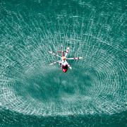 HM Coastguard search and rescue helicopter hovering over the Solent