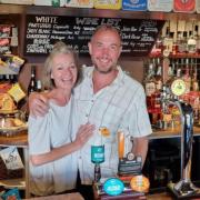 Cat and Mike Wallace behind the bar at The King Rufus