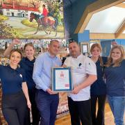 Staff at The Duke on the Test celebrating their latest award