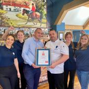 Staff at the Duke on the Test celebrate their award