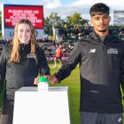 Young cricket players Eve O’Neill and Abubakar Rasheed switched on the new solar panels