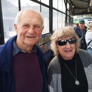 Margaret Blake is congratulated by her husband Roy after completing 90 lengths of Hythe Pier