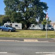 Travellers on a green space in Lordshill