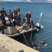 Divers in the 17 Port and Maritime Regiment plunge into the water during training