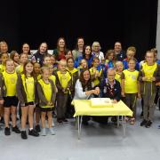 Past and present 2nd Calmore Brownies and leaders with Kay and Charlotte cutting the cake