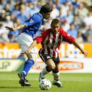 Southampton's Kevin Phillips (right) evades the challenge of Leicester's Muzzy Izzet during the FA Barclaycard Premiership match at the Walkers Stadium, Leicester, Saturday August 16, 2003. Leicester drew 2-2 with Southampton. PA Photo: David Davies.