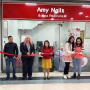 Cutting the ribbon to the new shop