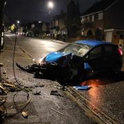 The aftermath of a car colliding with a telegraph pole on Woodmill Lane