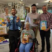 Team members and residents at Ancasta Grove presented their donations to the local food bank