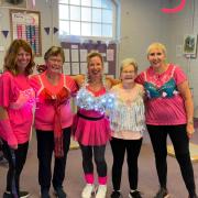 Members and staff donned pink outfits and bras for their gym sessions