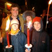 Alistair Scott, his partner Georgina and sons Thom and James await the start of the torchlit procession from Winchester Broadway to the fireworks display in North Walls recreation ground on Saturday T4068A photo Terry Bond