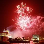 FIREWORKS AS QM2 DEPARTS SOUTHAMPTON ON HER MAIDEN VOYAGE, DOCK GATE 4, WITH THE SHIELDHALL AND THE IOW FERRY IN THE FOREGROUND