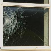 Stock image of a smashed window